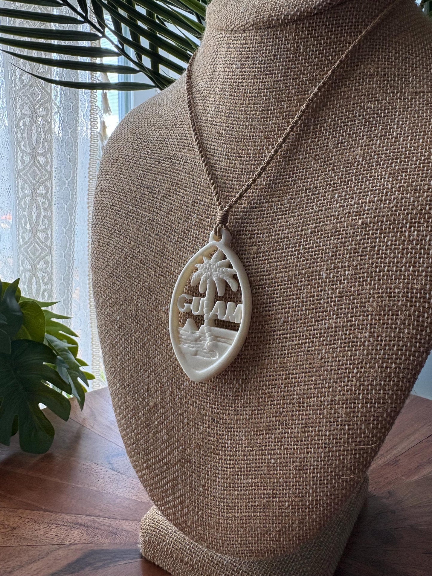 Hand Carved Bone Guam Sling Stone Seal Pendant and Necklace –  Guåhan and CHamoru Pride