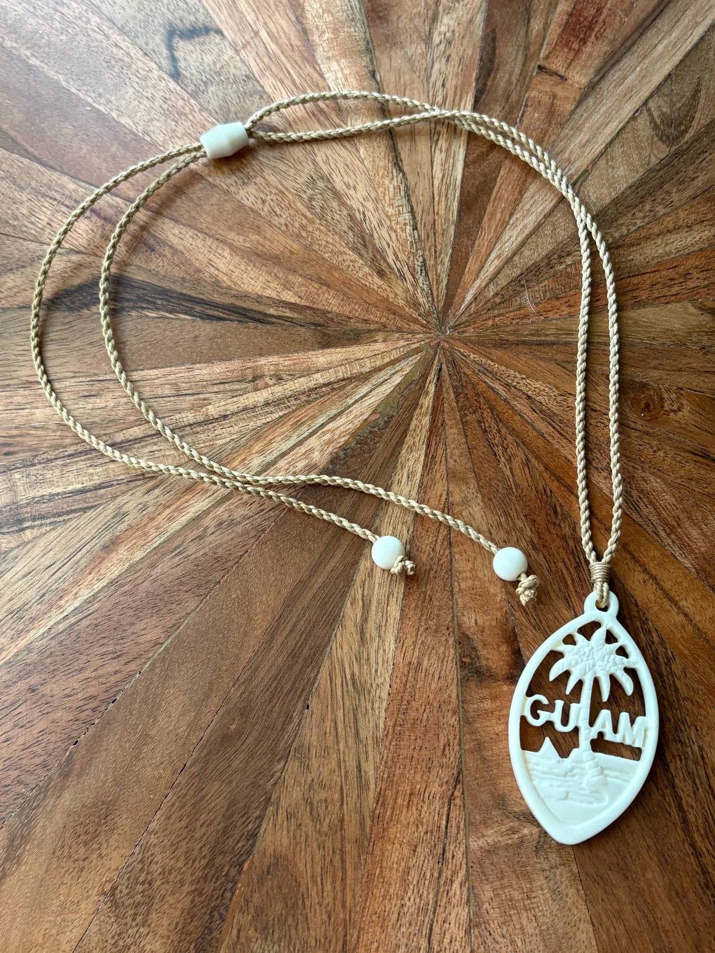Hand Carved Bone Guam Sling Stone Seal Pendant and Necklace –  Guåhan and CHamoru Pride