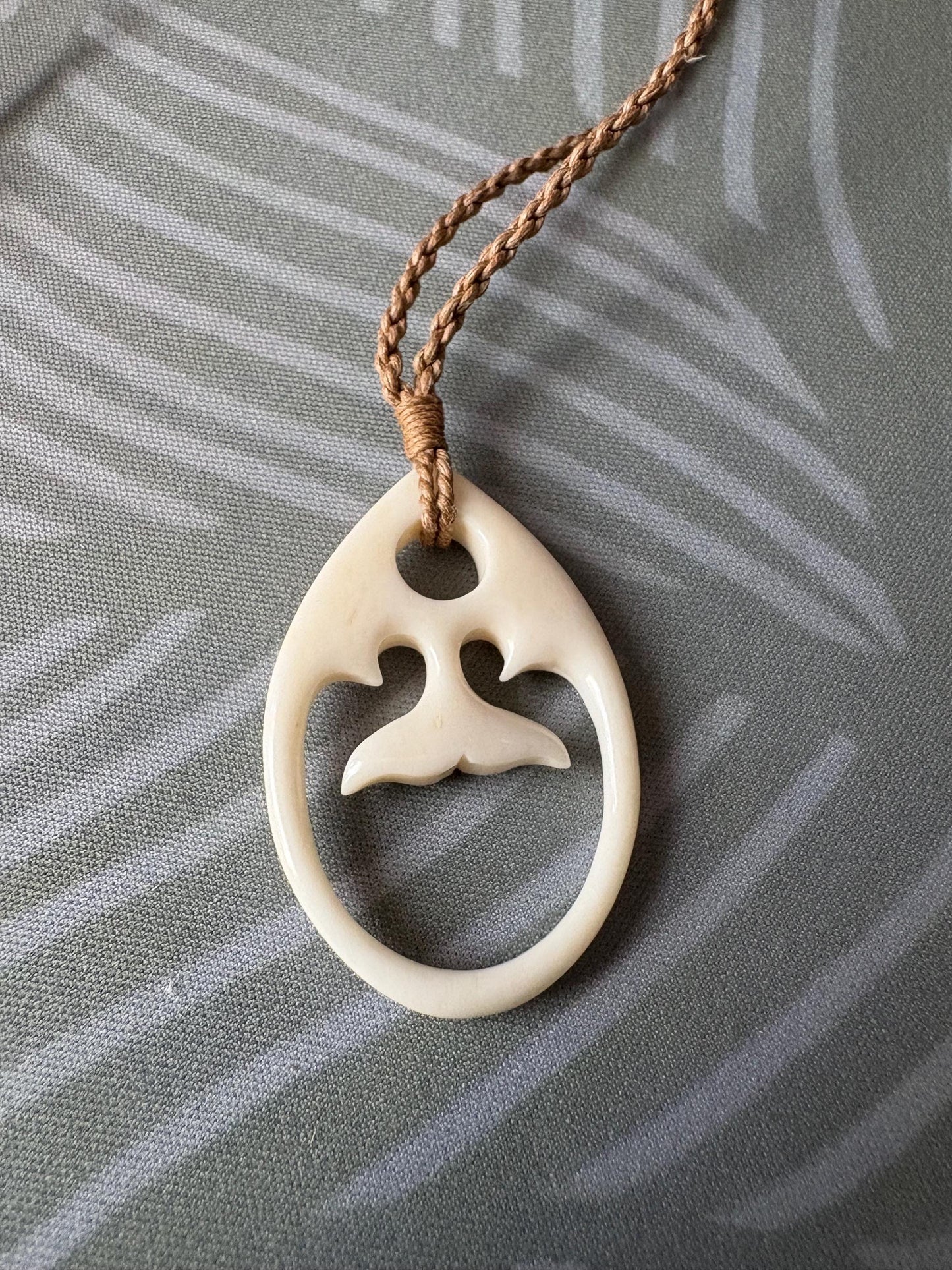Solid Buffalo Bone Hand Carved Whale Tail Adjustable Pendant and Surfer Cord Necklace