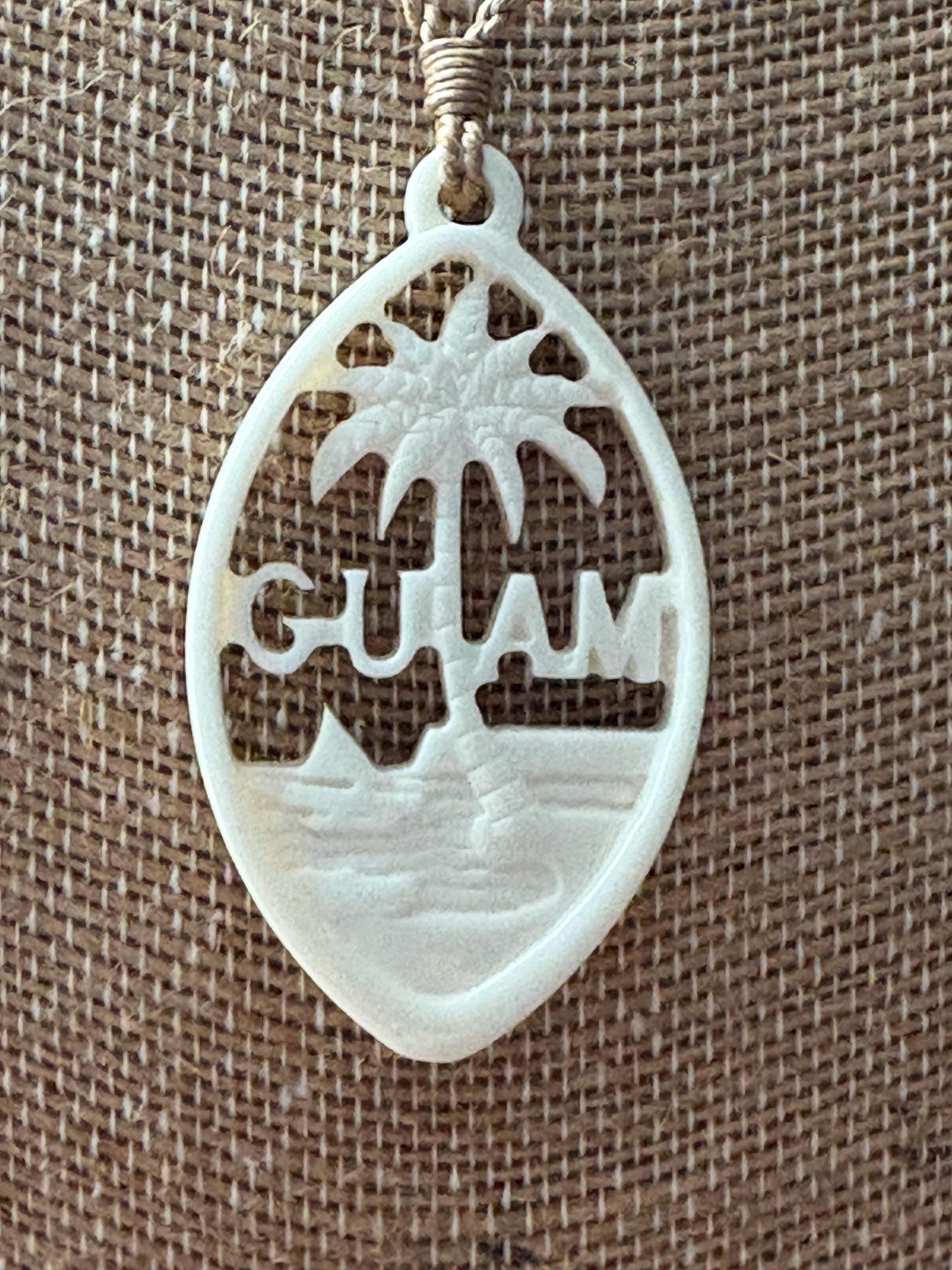 Hand Carved Bone Guam Sling Stone Seal Pendant and Necklace –  Guåhan and CHamoru Pride