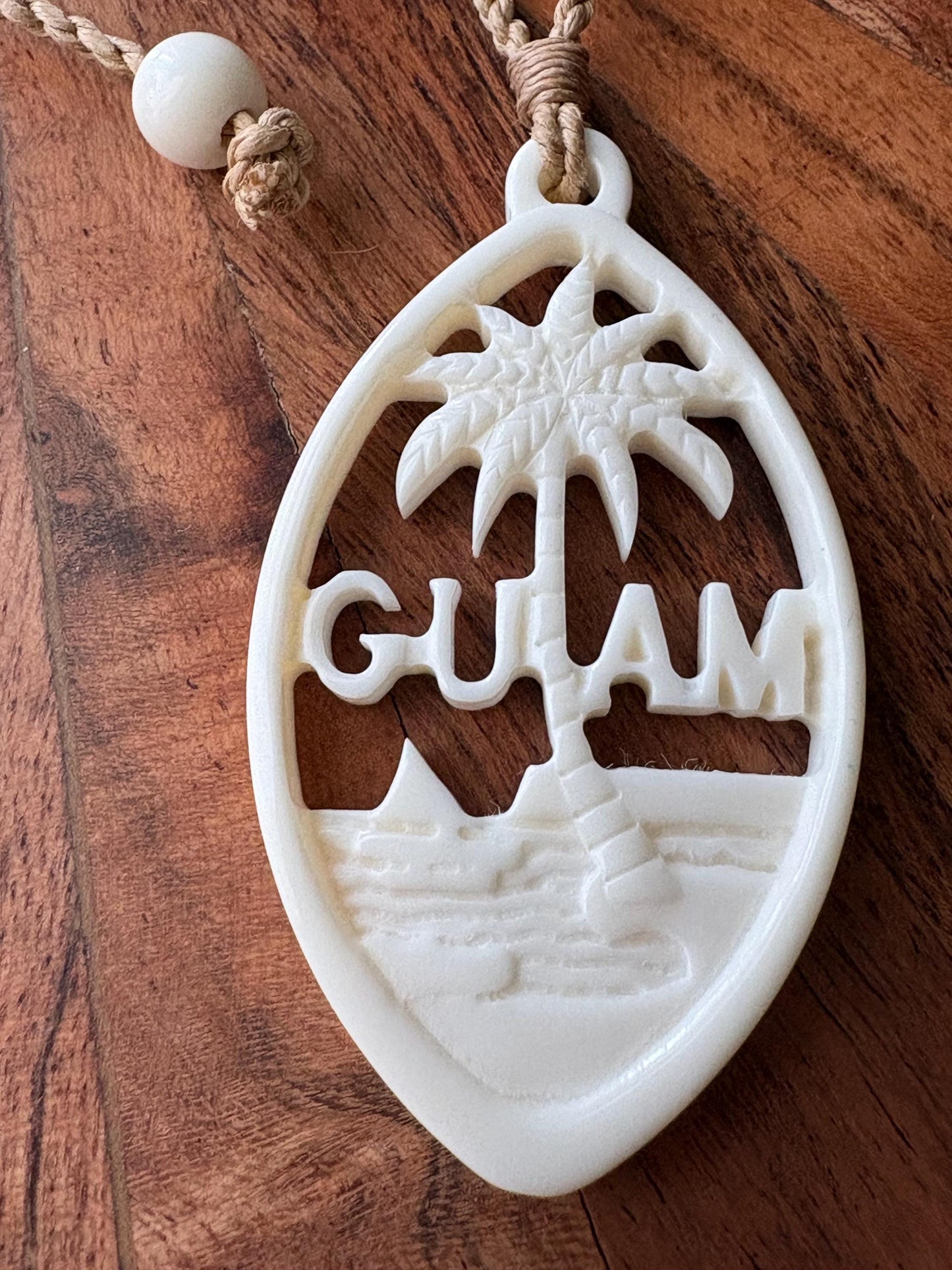 Hand Carved Bone Guam Sling Stone Seal Pendant and Necklace –  Guåhan and CHamoru Pride