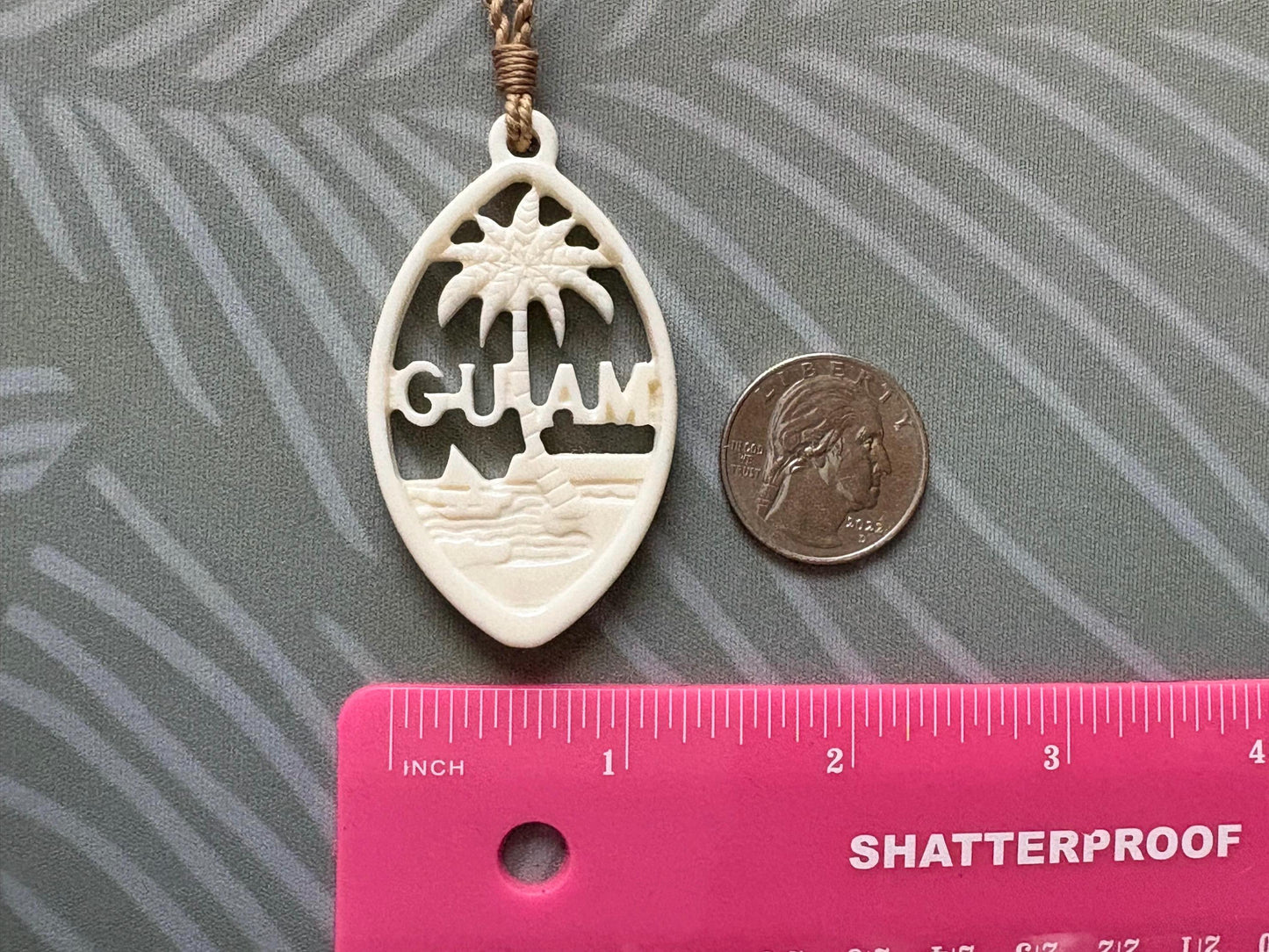 Hand Carved Bone Guam Sling Stone Seal Pendant and Necklace –  Guåhan and CHamoru Pride