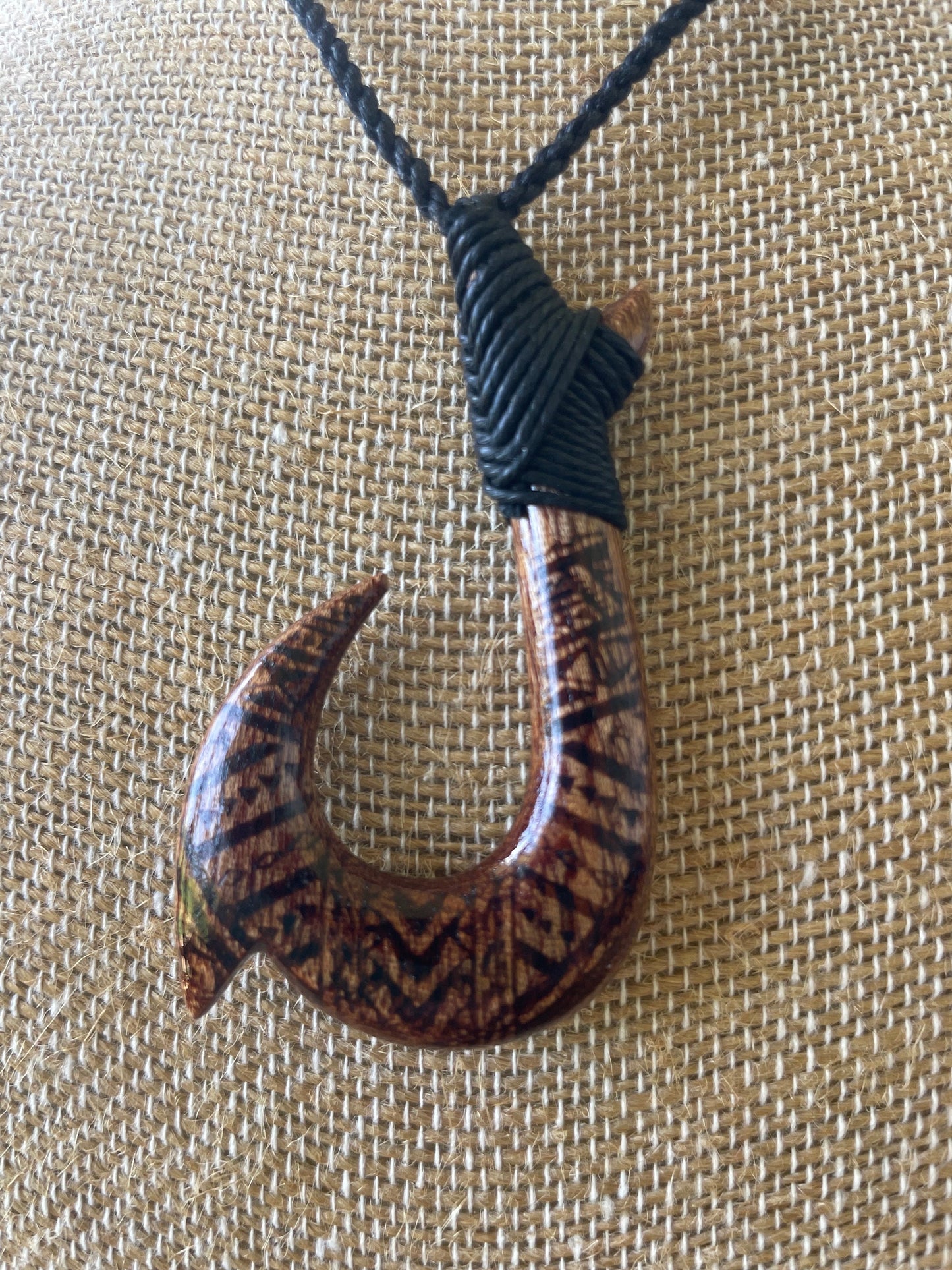 Handsomely Hand Carved Koa Wood Hawaiian Makau (Fish Hook) Necklace with Traditional Polynesian Designs. Adjustable Surfer Cord for Anyone