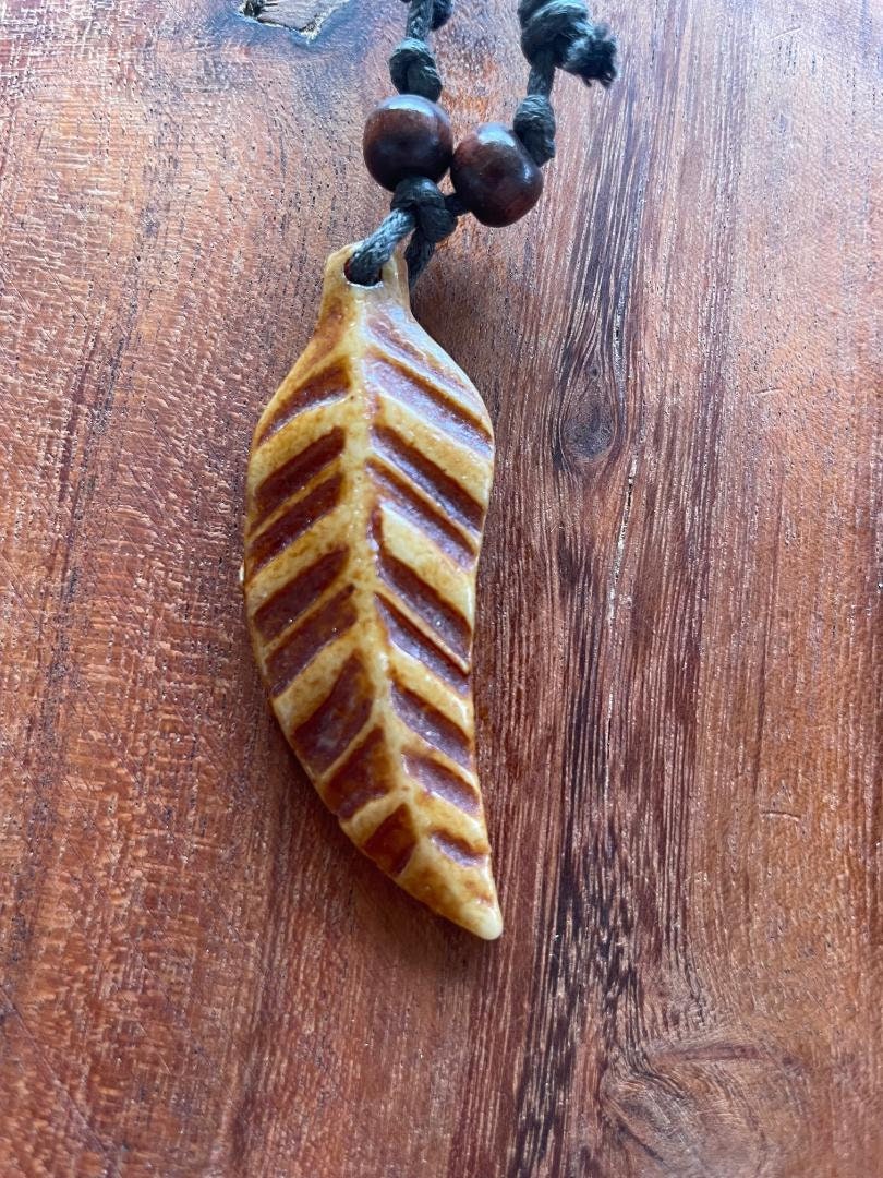 Simple and Quaint Bohemian Styled Handcrafted Tribal Feather Adjustable Bone & Resin Necklace