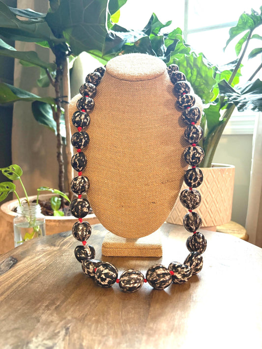 Authentic Kukui Nut Lei: 32" Black & White with Red Ribbon