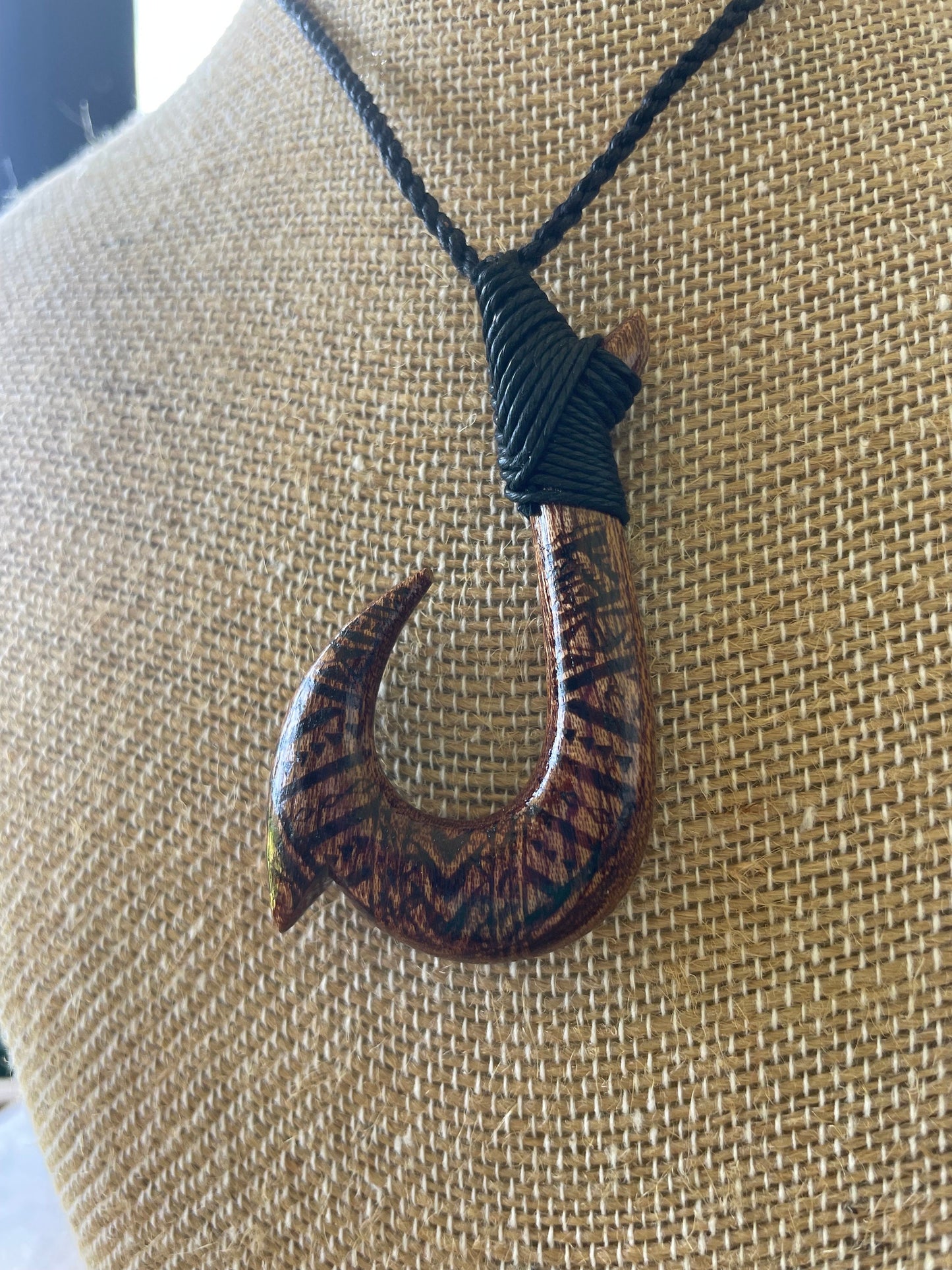 Handsomely Hand Carved Koa Wood Hawaiian Makau (Fish Hook) Necklace with Traditional Polynesian Designs. Adjustable Surfer Cord for Anyone